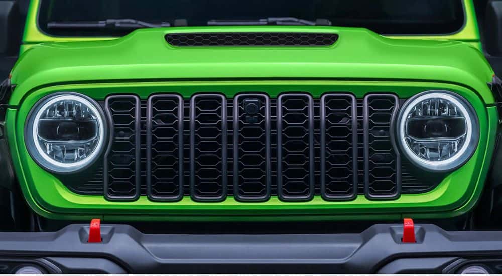 Green 2026 Jeep Wrangler grill close up.