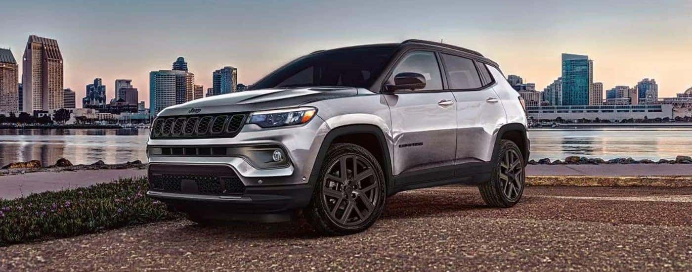 Grey 2026 Jeep Compass Limited Altitude on the riverfront.