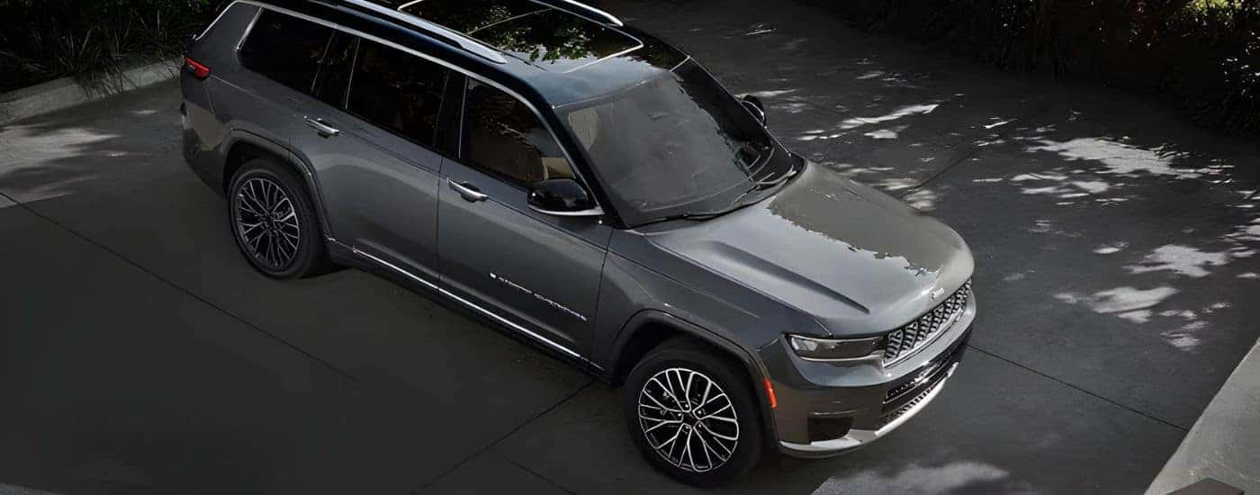 A grey 2024 Jeep Grand Cherokee is shown from the front at an angle.