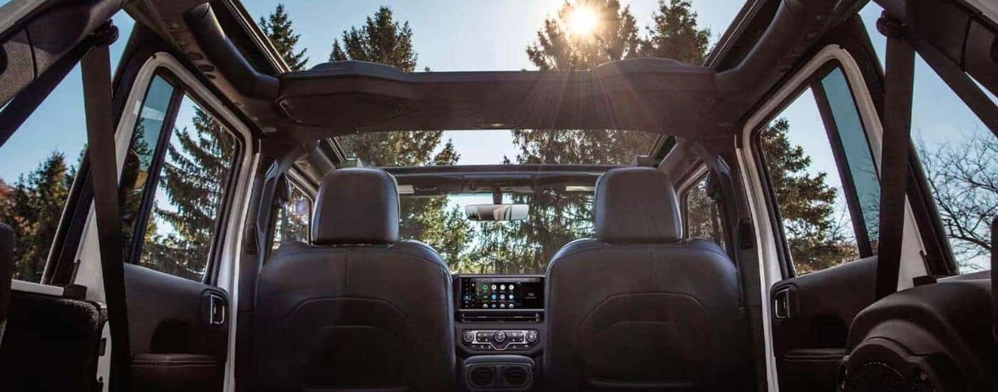 Interior view of a 2026 Jeep Wrangler from back seat.