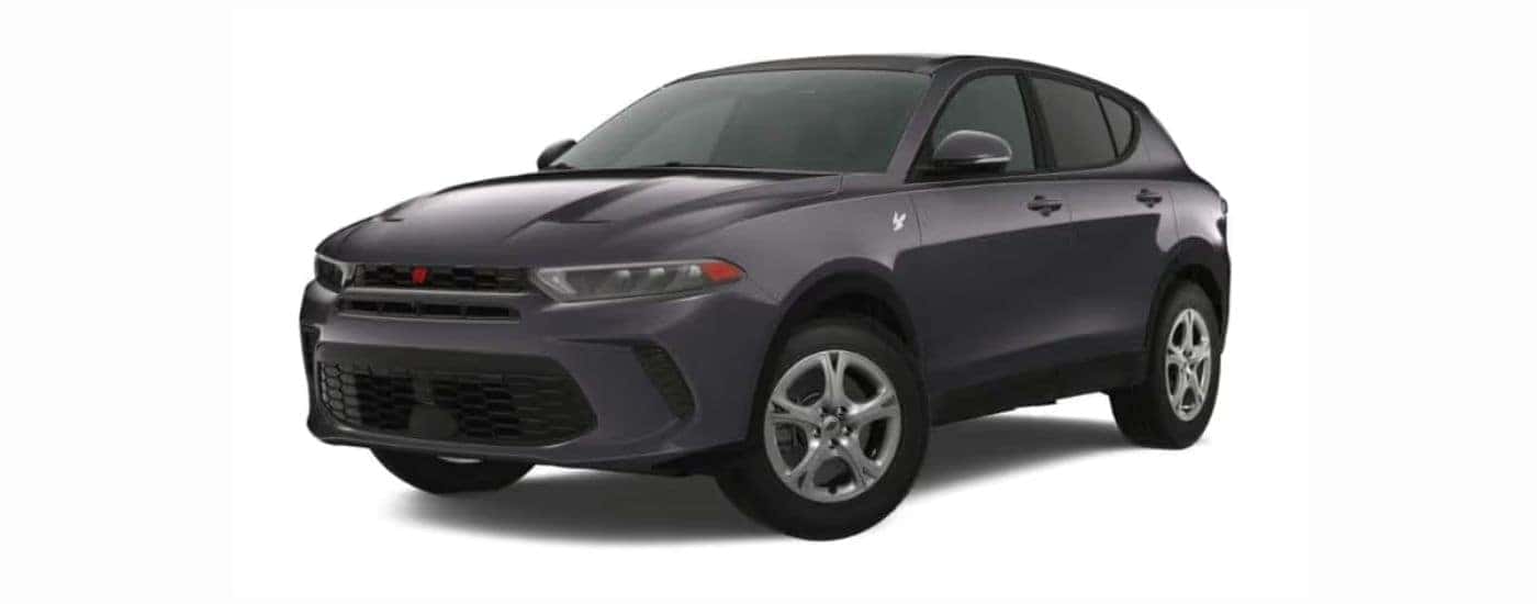 A gray 2023 Dodge Hornet with a white background.