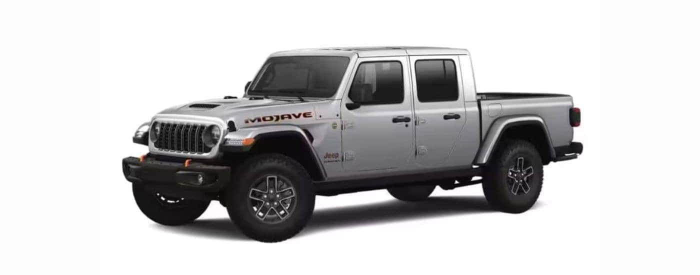 A gray 2024 Jeep Gladiator with a white background.