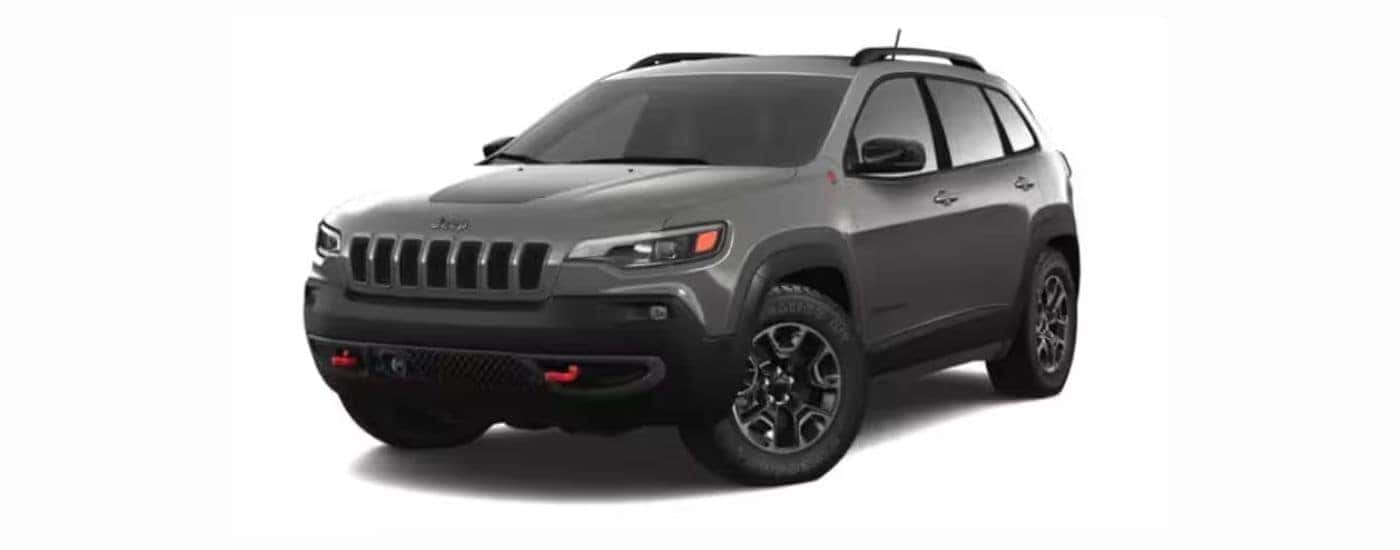 A grey 2021 Jeep Cherokee with a white background.