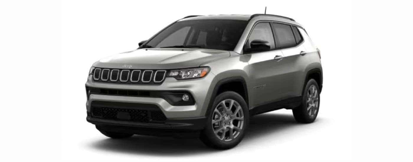 A silver 2022 Jeep Compass with a white background angled left.