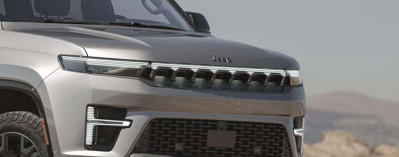 Close-up of the front grille on a silver 2026 Jeep Grand Wagoneer.
