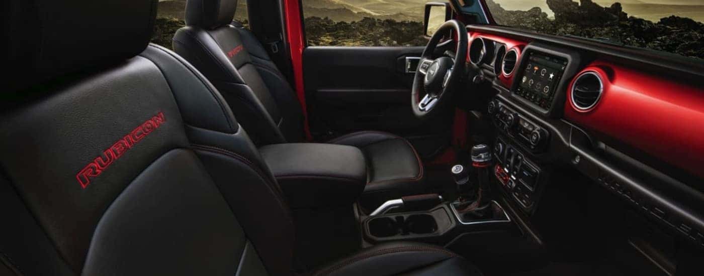 Black leather interior in a red 2021 Jeep Wrangler