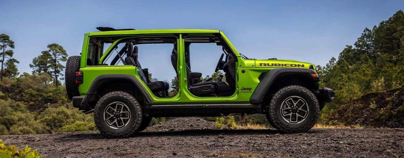 Green 2026 Jeep Wrangler Rubicon parked off-road