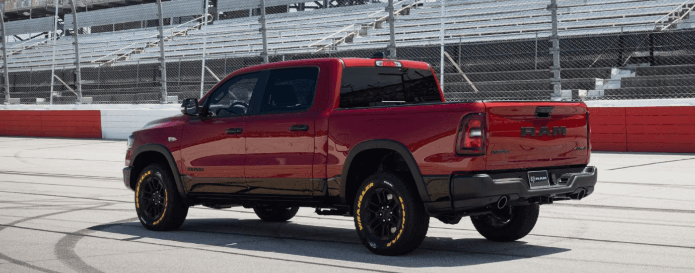 Red 2026 Ram 1500 parked on a race track