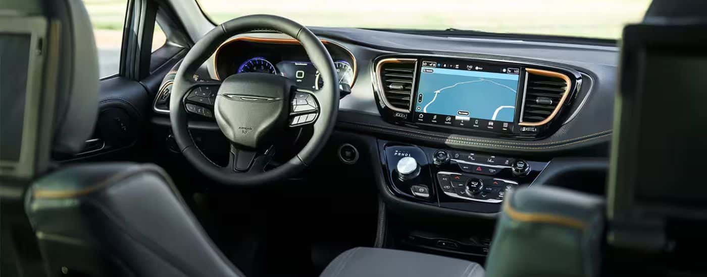 Infotainment display and steering in a 2027 Chrysler Pacifica.